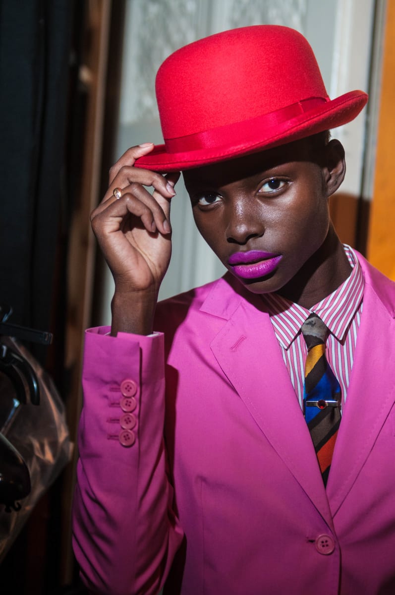 Untitled  Image: Jeneil Williams wearing a suit ensemble designed by Paul Smith, inspired by Willy Covary's suit in Daniele Tamagni's photobook 'Gentlemen of Bacongo'