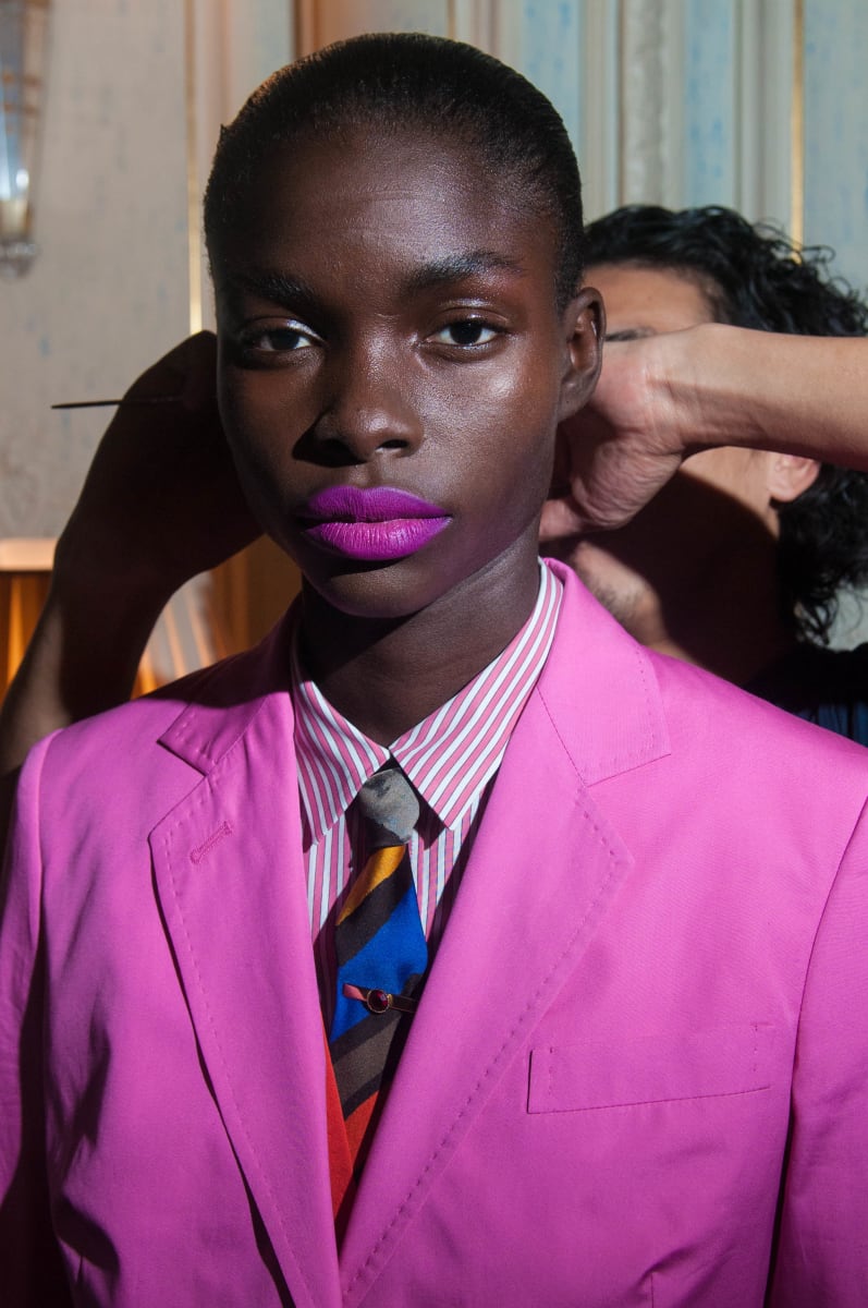 Untitled  Image: Jeneil Williams getting ready for the Spring 2010 Ready-to-Wear runway, wearing a suit ensemble designed by Paul Smith, inspired by Willy Covary's suit in Daniele Tamagni's photobook 'Gentlemen of Bacongo'