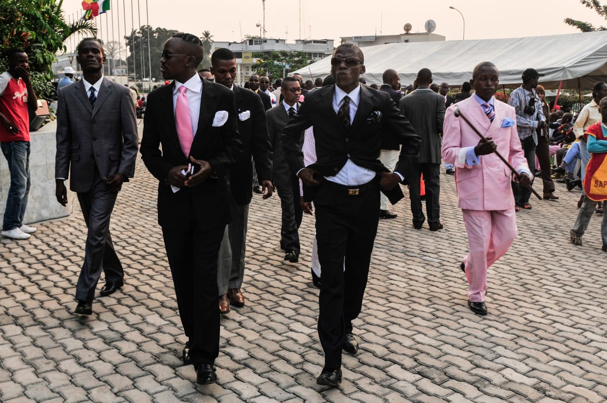 Untitled  Image: Group of Sapeurs walking into the pary. Brazzaville, Congo (2008)