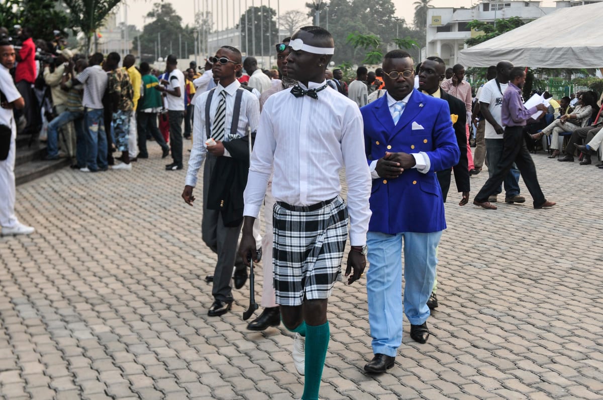 Untitled  Image: A member of the Piccadilly Group leading his friends into the party. Brazzaville, Congo (2008)
