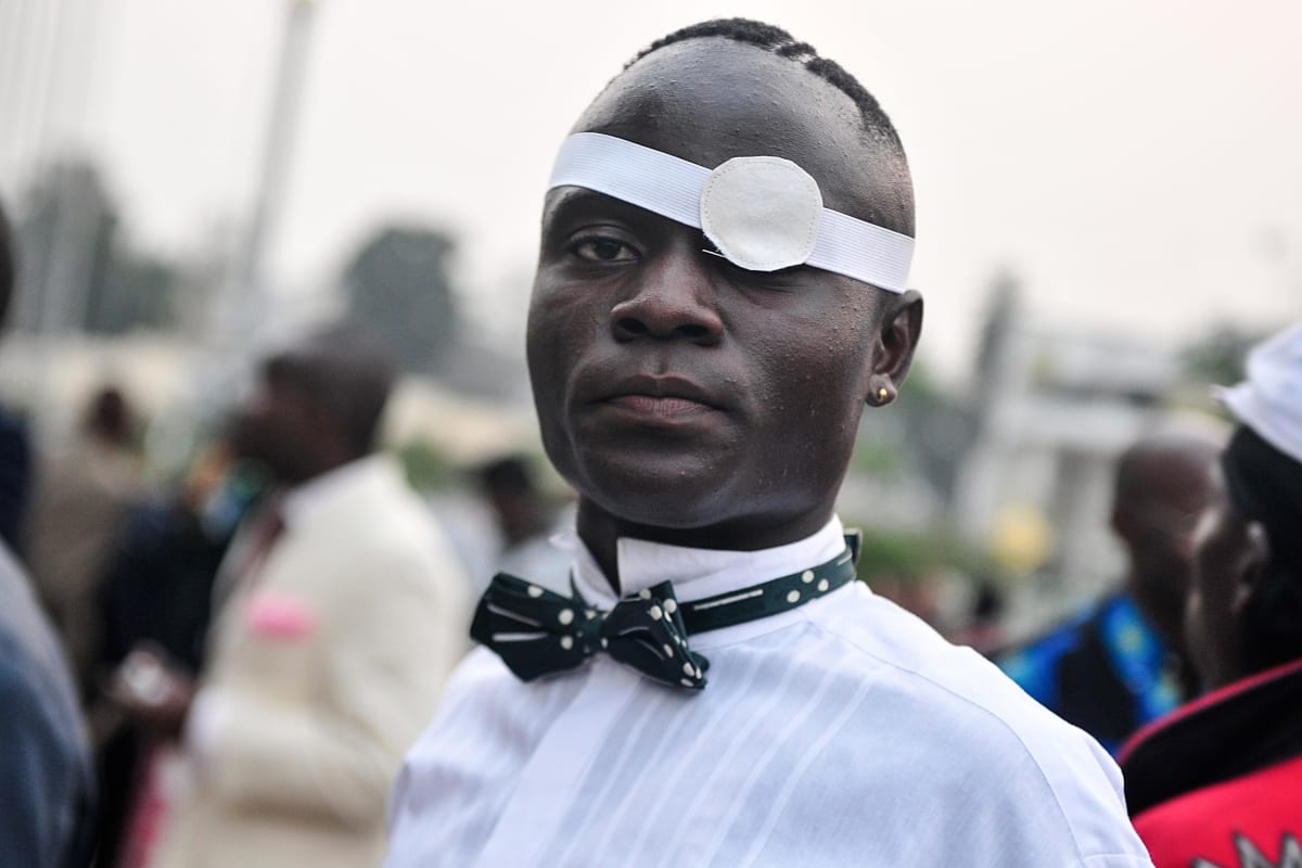 Untitled (Vive la Sape #3)  Image: Portrait of a member of the Piccadilly Group wearing a bowtie and an eye patch. Brazzaville, Congo (2008)