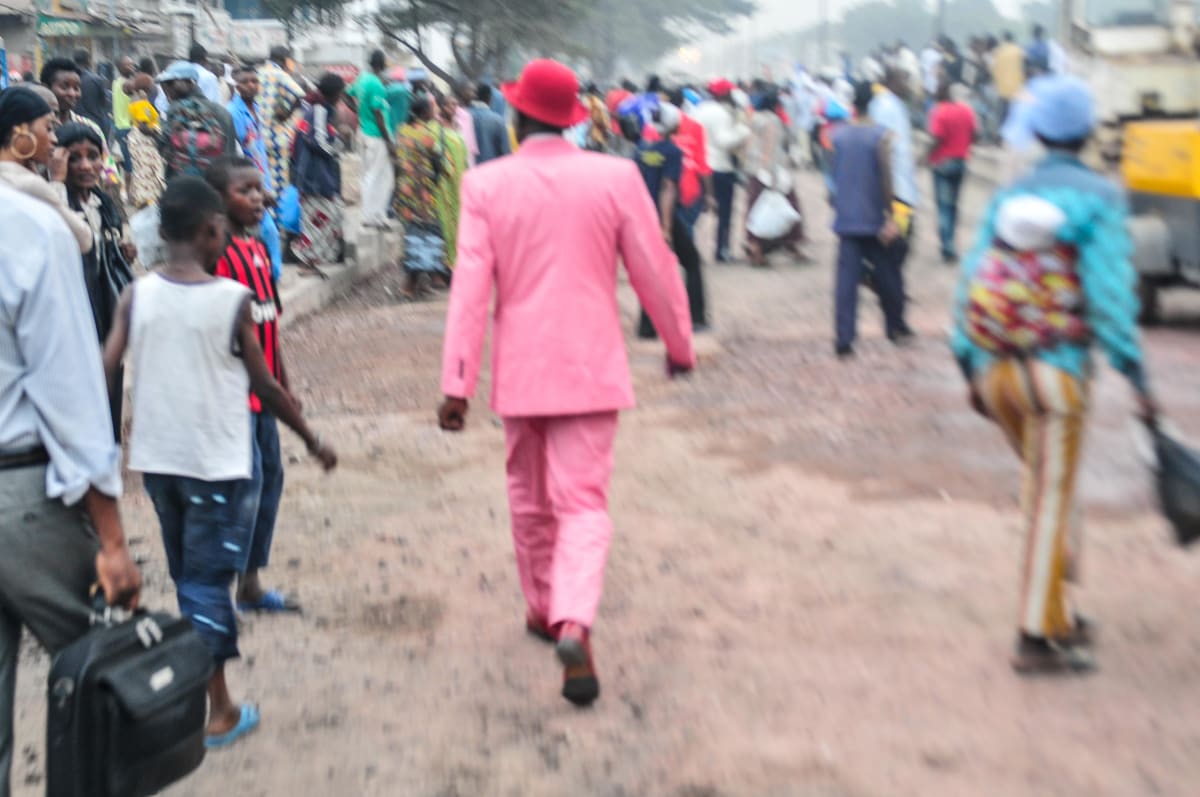 Untitled (Willy Walking)  Image: Willy Covary walking away into the crowd. Brazzaville, Congo (2008)