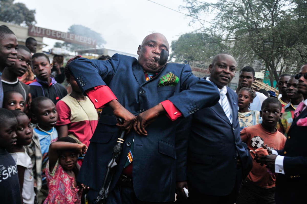 Untitled  Image: Sapeur performing in the crowd during a party, with his elbows held high. Brazzaville, Congo (2008)