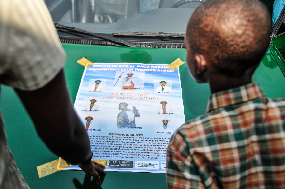 Untitled  Image: A poster advertising Kvv Mouzieto's and Paco Rabane's first album "Sape Ezalie" stuck to the front boot of a green car. Brazzaville, Congo (2008)
