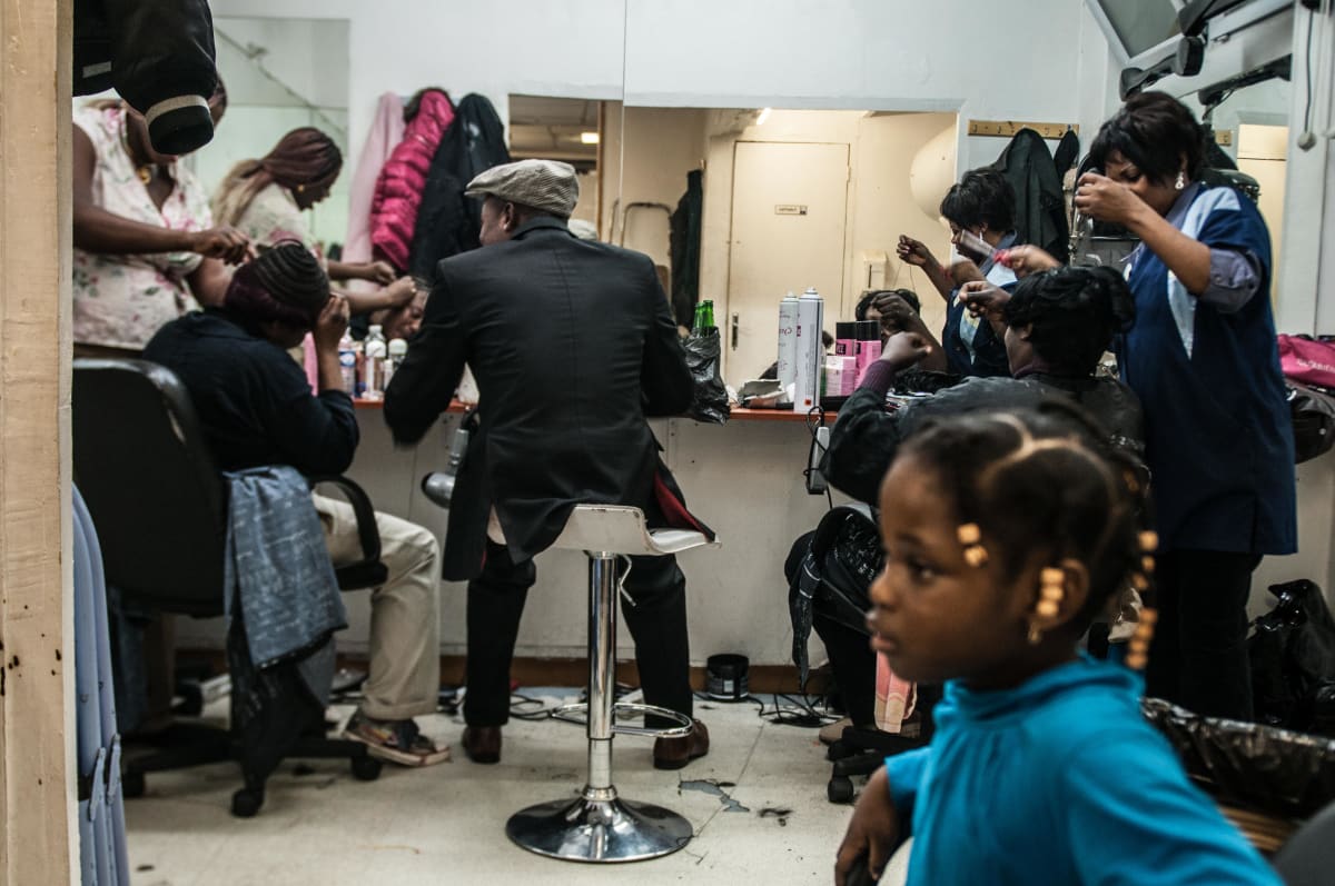 Untitled (The Hairdresser)  Image: African women and Sapeurs getting a haircut at a hairdresser in Paris (2008)