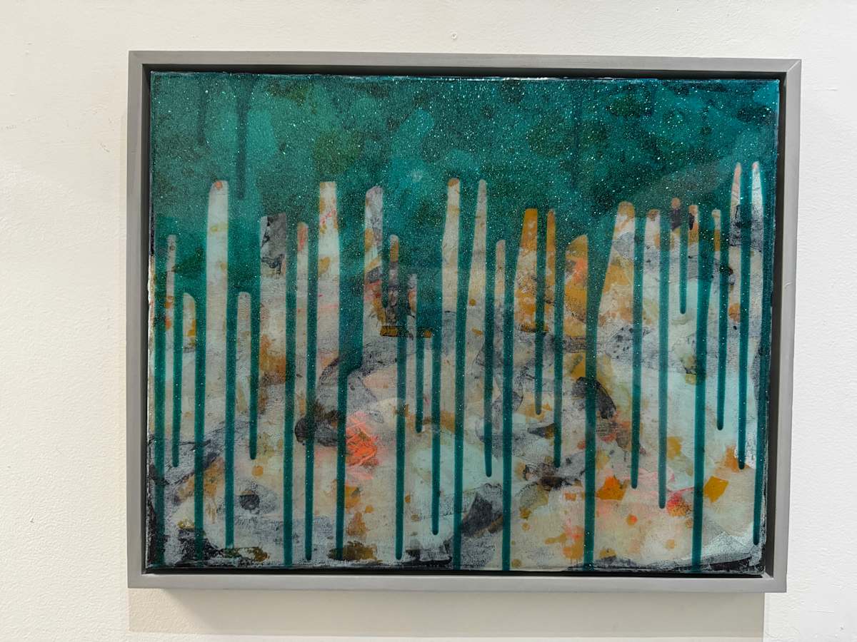 Emerald Reflection by Will Schmahl  Image: Description:

This artwork evokes the sensation of peering beneath the surface of water, where light and shadow dance across submerged textures. The upper portion, awash in deep teal, feels like the vast unknown of the ocean or the sky at dusk, while the lower half carries an ethereal, marbled effect—reminiscent of corals, icy landscapes, or shifting sands. The vertical streaks running through the composition resemble drips of ink, rainfall, or even roots stretching downward, as if the piece is in constant motion, bridging two worlds.

The interplay of opacity and translucence, along with hints of warm orange and earth tones, suggests the passage of time—memories sinking, nature evolving, or an abstract skyline dissolving into the depths. It’s both tranquil and haunting, inviting the viewer to lose themselves in its fluid layers.
