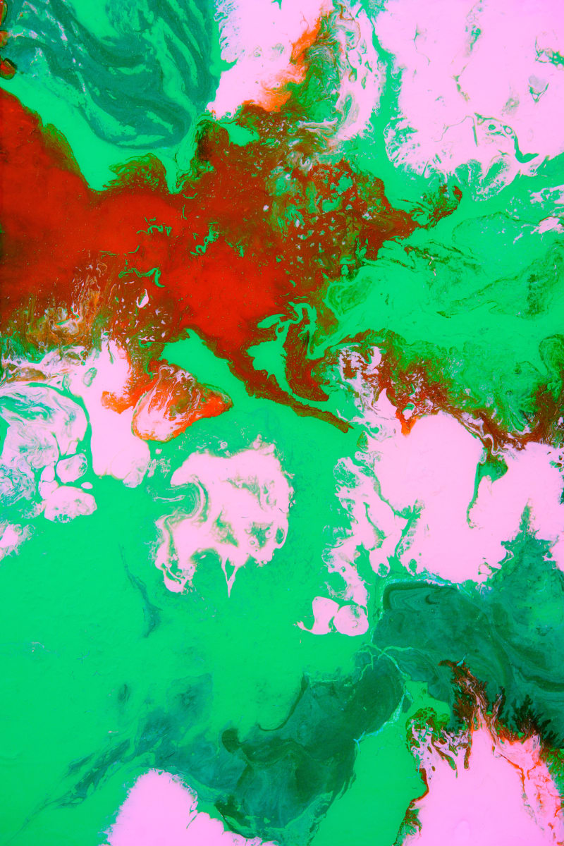 Vivid Reverie by Will Schmahl  Image: A bold explosion of emerald greens, fiery reds, and soft pinks creates a striking interplay of color and movement in this dynamic abstract piece. 