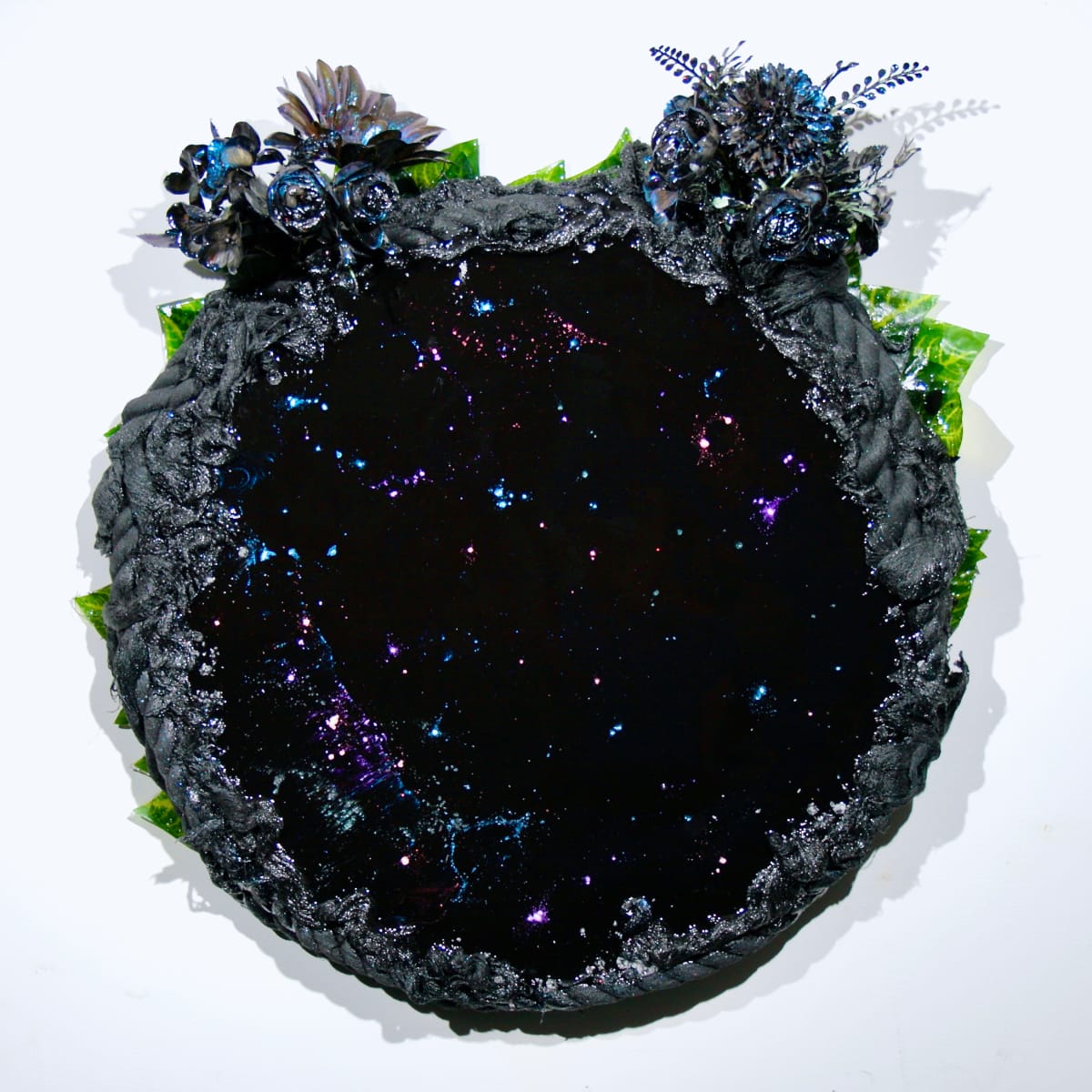 Fleur-de-lis by Mark Stafford  Image: Collector's note: This piece has a slightly different bold reflective black surface with faraway galaxies and a cluster of flowers/observers above.