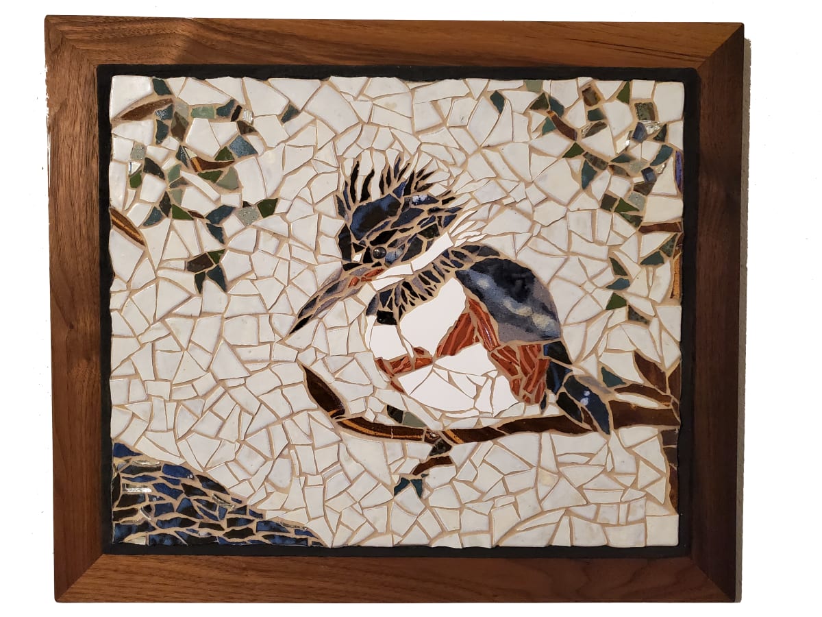 Lady Kingfisher by Sue Rose  Image: The lady is made of ceramic tile, mirror, and an eye of hematite, floating over an oiled walnut frame. Cement substrate.