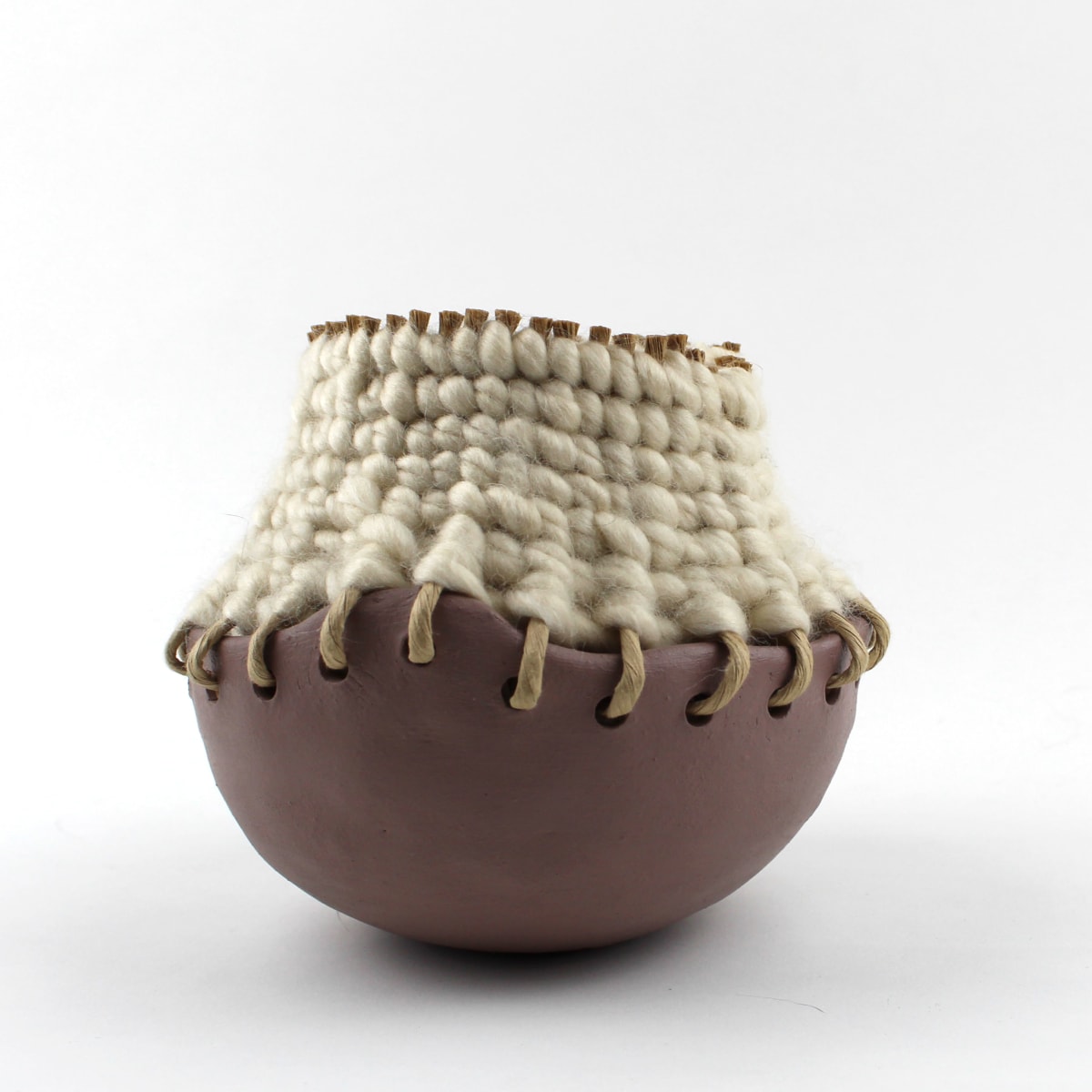 Basketpot 7 by Essa Baird  Image: A collection of hand built ceramic bottoms paired with basket weaving technique tops. Using different weaving types + materials such as fiber rush, yarn, and twine.