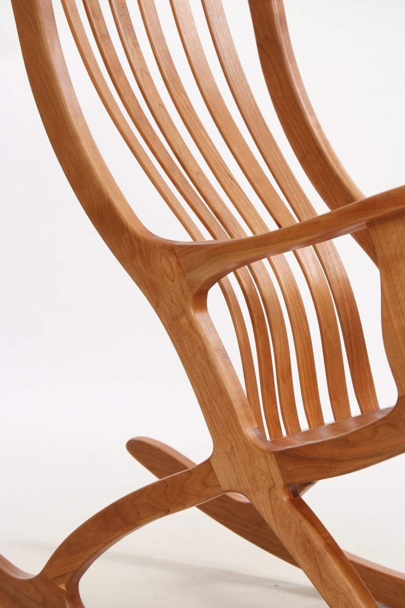 Patented cantilever seated ergonomic cherry rocking chair by Robert Bragg, Image 1.