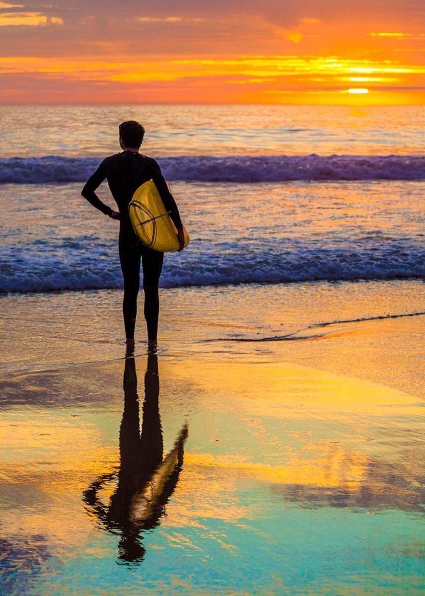 Surfer by sea at sunset by Debra Behr, Image 1.