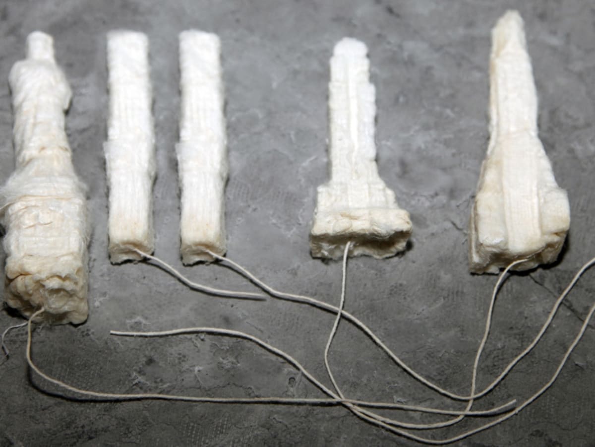 Building Tampons S,M,L,XL Absorbency by Coralina Rodriguez Meyer  Image: Building Tampons S,M,L,XL Absorbency NYC landmarks as tampons, human scale including Statue of Liberty S, Chrysler M, Empire State L, World Trade Center XL 