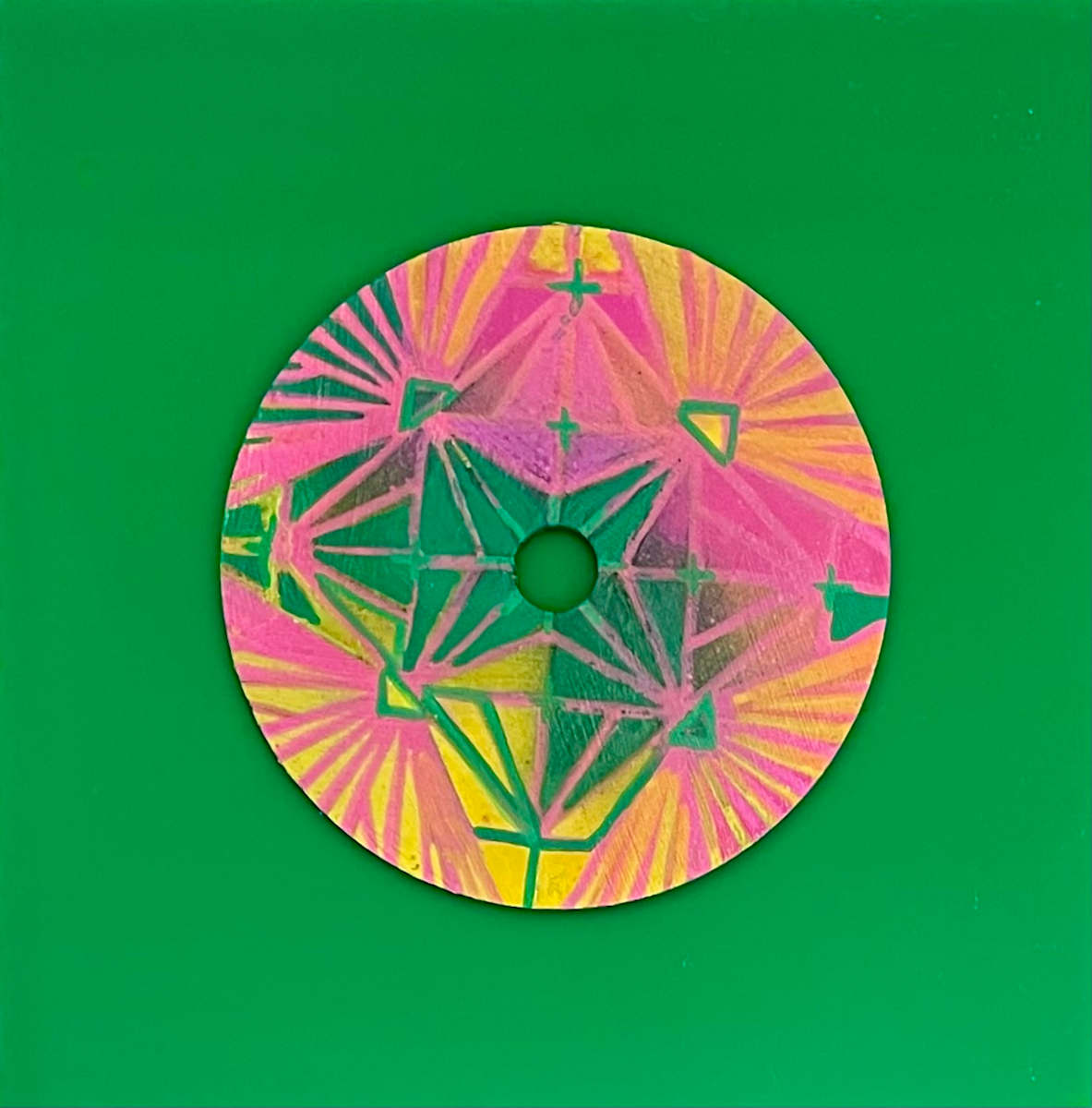 Crystal Star by Dr. Vasundhara (Vasu) Tolia  Image: A vibrant geometric composition featuring radiating star
patterns and angular shapes in bright pinks, yellows, and greens, creating a
kaleidoscopic effect with crystalline formations