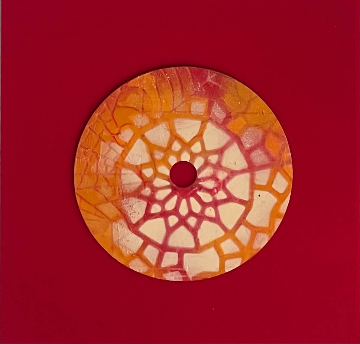Golden Web Mandala by Dr. Vasundhara (Vasu) Tolia  Image: An intricate mandala pattern in warm amber and
cream tones, featuring radiating geometric segments that create a delicate web-like
design.