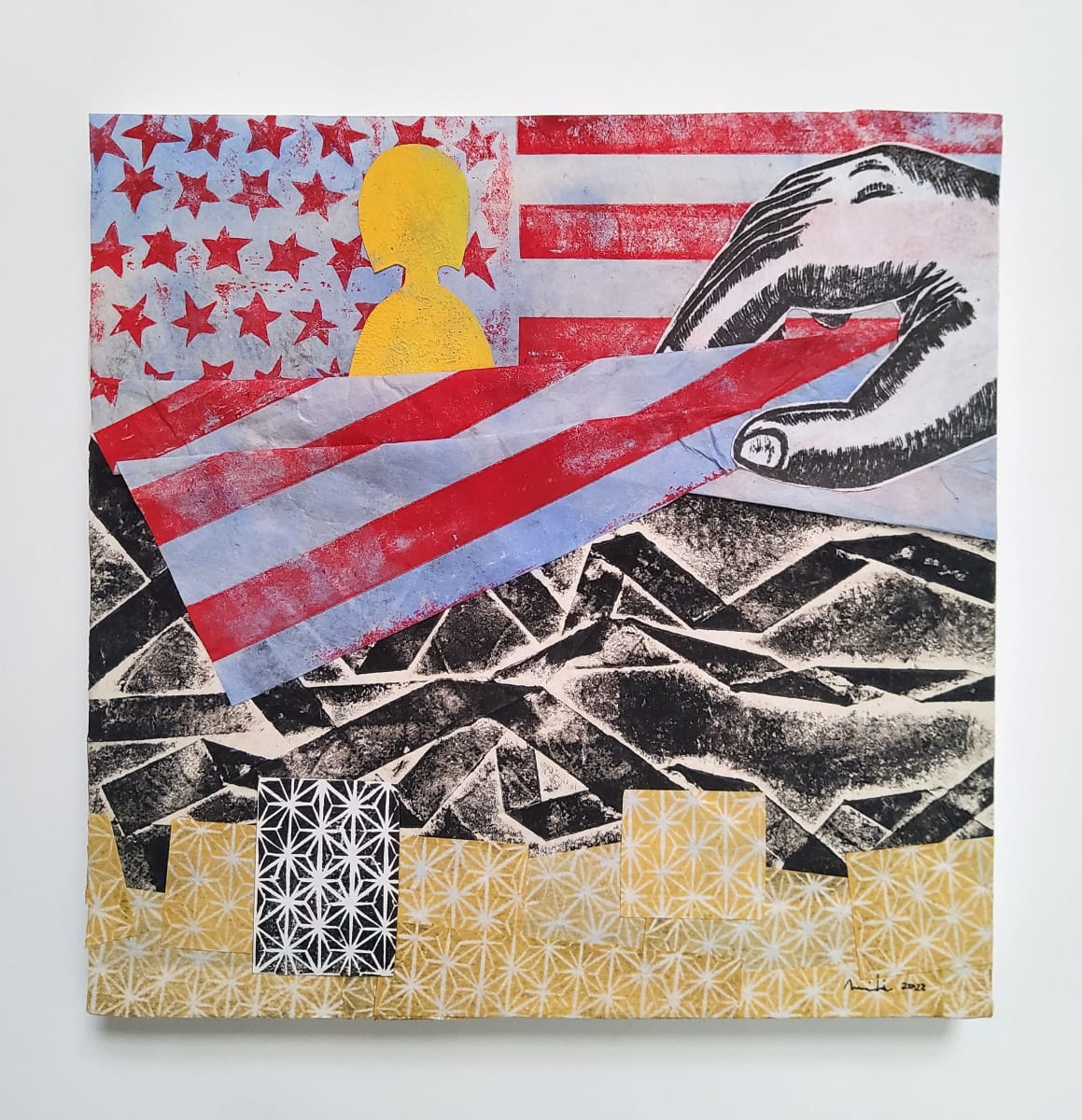 Americanized Japanese by Miki Nishida Goerdt  Image: My connection to my culture of origin is important to the process of dismantling the internalized racism and assimilation within me since moving to the U.S.. This piece is a snapshot of how I see myself today, a decade into the dismantling process.The top layer depicts the American flag, symbolizing the Americanized communication style I’ve acquired. The middle layer shows the life I had in Japan. Much like any immigrants, I had a life in a different country, a life that looks drastically different from my current life in the U.S. That former life never leaves me — I will always see my current life through the lens of my past experience in Japan. The bottom layer depicts a traditional Japanese pattern called Asa-no-ha (hemp leaves), a pattern often used as a wish for healthy growth and resilience. This third layer — resilience within my culture of origin — is one I didn’t see much of in my first 10 years in the U.S., due to the impact assimilation had on me. Today I recognize the value of Japanese culture and see how it contributed to the resilience I feel today, thanks to my daughter and my husband, and to others who have been part of the path that I have been walking.
