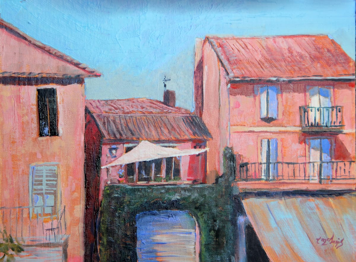 Chasing the Sun in L'Isle-sur-la Sorgue by Theresia McInnis  Image: 9x12 oil painting, a charming scene unfolds on a second-story patio in the ancient Provencal city of L'Isle-sur-la Sorgue. The patio is bathed in warm afternoon sunlight, and a sail awning gracefully billows above, providing gentle shade.