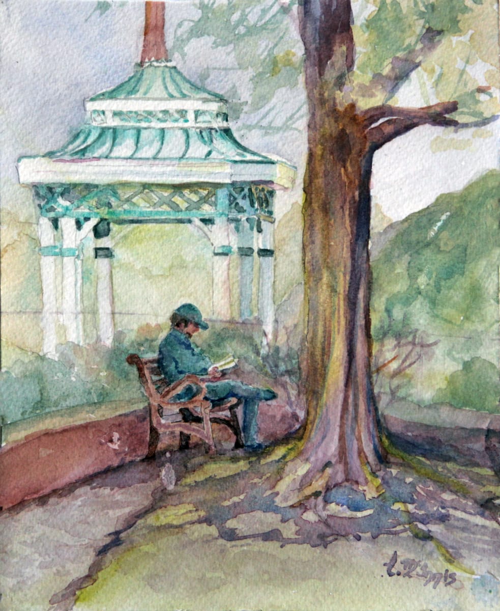 Reading on the Square by Theresia McInnis  Image: I consider Monroeville the Literary capital of the south.  This patron was taking in a good read on the square in a shady spot.