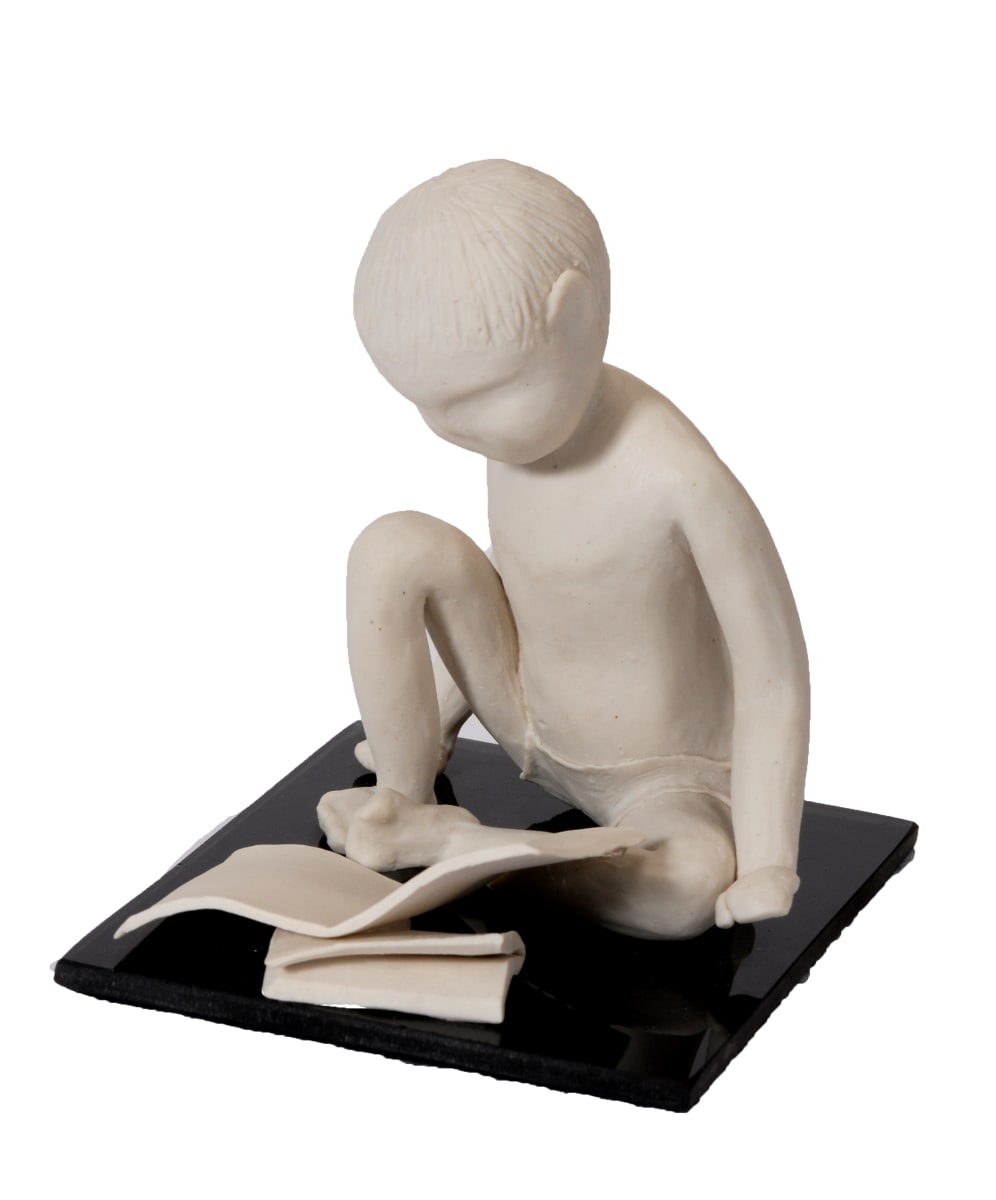 Little Boy Reading by Bonnie Adams  Image: The inspiration for this piece came from my youngest son who loved to read.  ...The finished clay has experienced movement and transformation in the kiln – a birthing process if you will.  So creating sculptures of my children was like giving them life – forever.