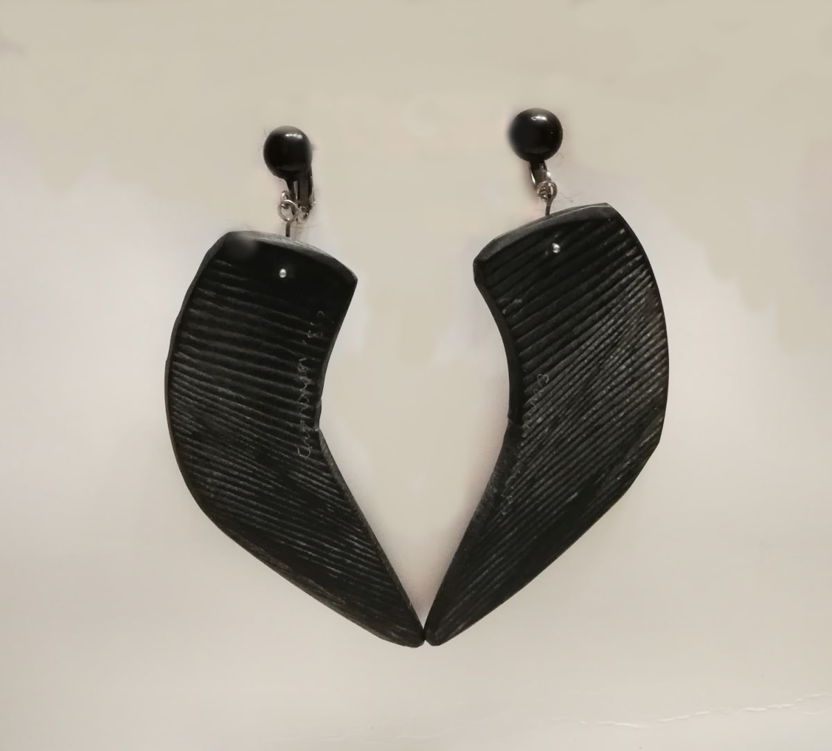 Black 'slice' Crescent earrings with sterling silver fish hook  Image: Black 'slice' Crescent earrings with sterling silver fish hook