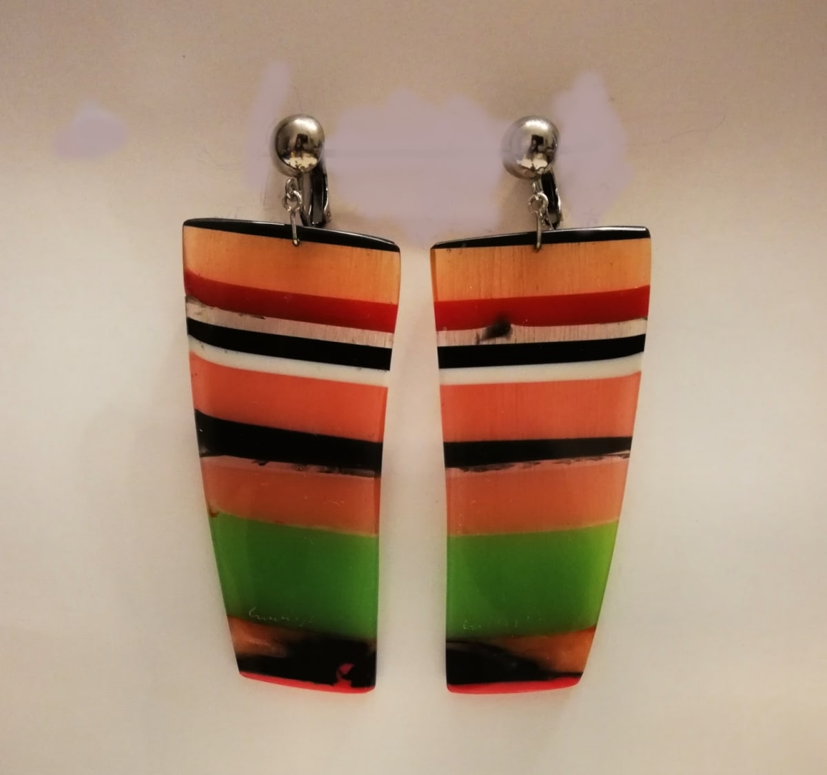 Slice Earrings by cara croninger works  Image: Black, green, orange, watermelon, white, red-striped  with stainless steel clips