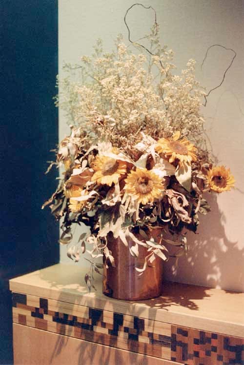 Sunflowers and Cabinet at end of Hallway by Eve Mero 