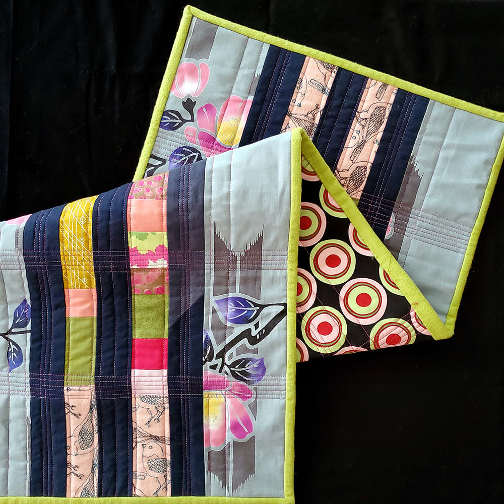 SYNESTHESIA Table Runner: Chartreuse / Fuchsia 1  Image: SYNESTHESIA Table Runner: Chartreuse / Fuchsia 1
Hand-dyed cotton, Yukata cotton, reclaimed curtains, reclaimed garments, other fabrics, machine pieced and quilted.
14"w x 37"h
Created for Factory Obscura's SYNESTHESIA installation at the Fred Jones Jr. Museum of Art, 2022. Inspired by the work of Oklahoma artist Olinka Hrdy