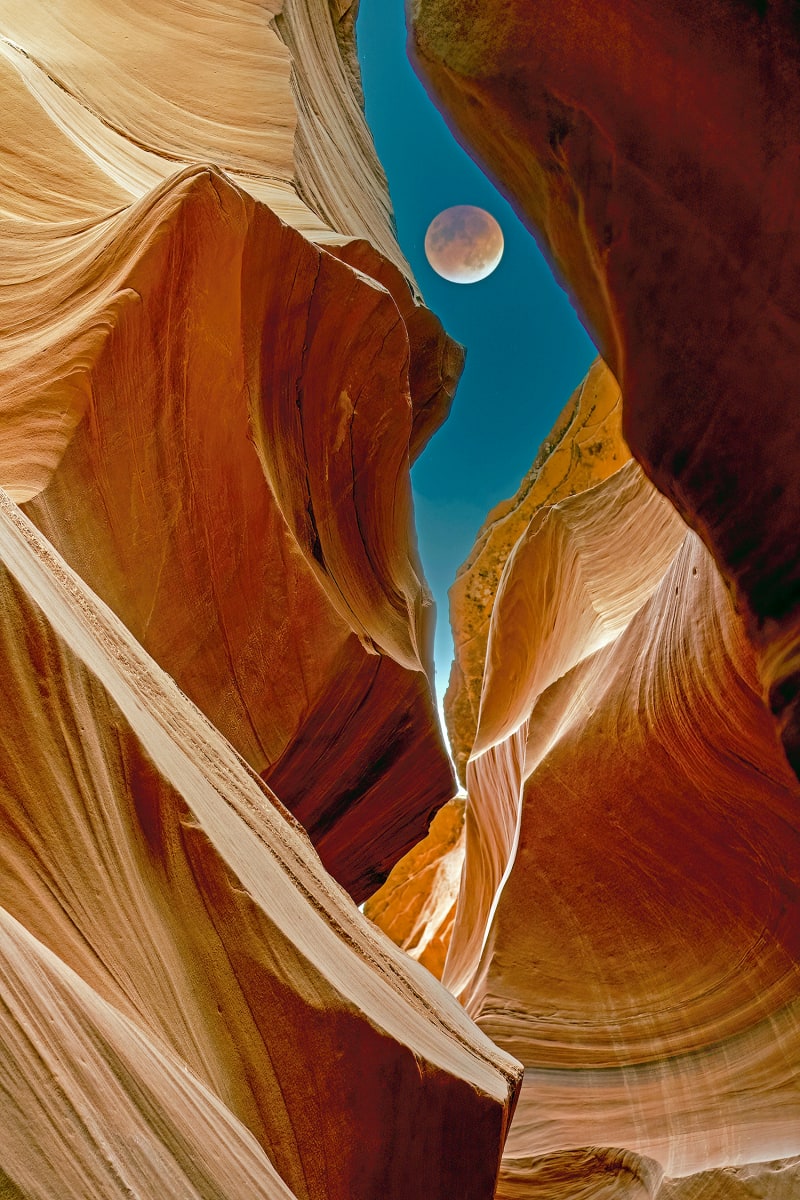 Slot Canyon 10 by Sandra Swan  Image: A view of the moon through the fantastic natural sandstone canyons of the Southwest USA 