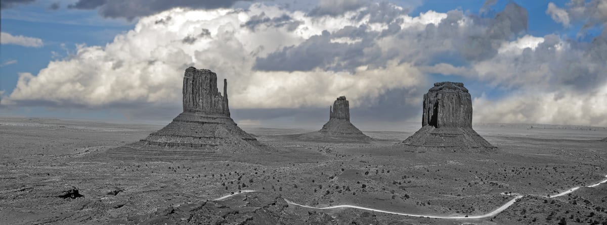Monument Valley BWC Iconic by Sandra Swan  Image: BWC=Black and White and Color! Contemporary edit of a iconic American landscape. Foreground in Black and White and background in color.