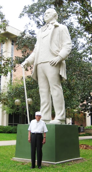 Sam Houston Standing by David Adickes  Image: M. B. Etheridge standing beside Sam Houston statue.