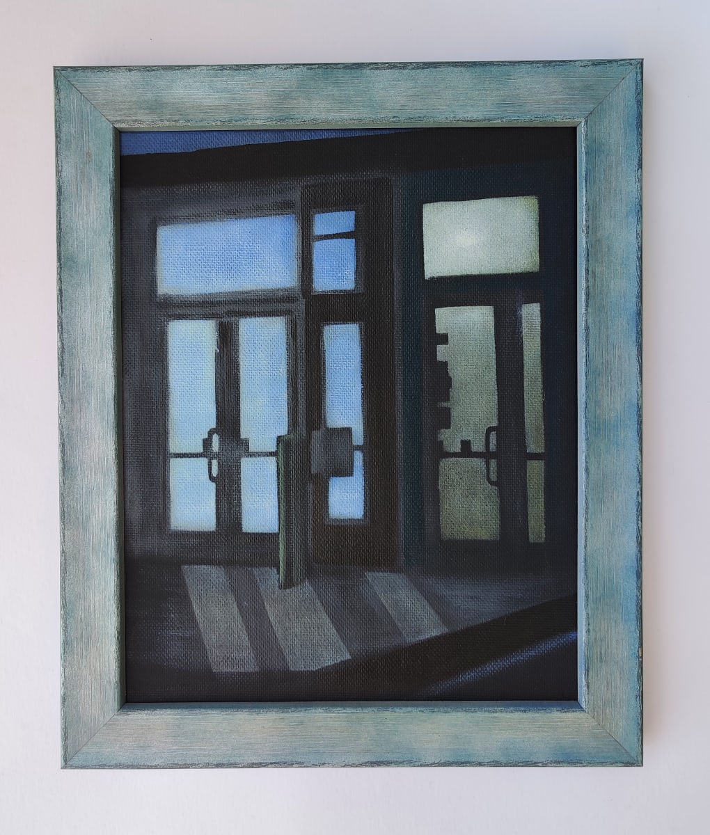 doors, night by Heather Lewis  Image: A regular sort of street corner, with shop doors. Empty, at night, but still lit. Quiet places like this are fascinating. I love the qualities of light in different spaces. 