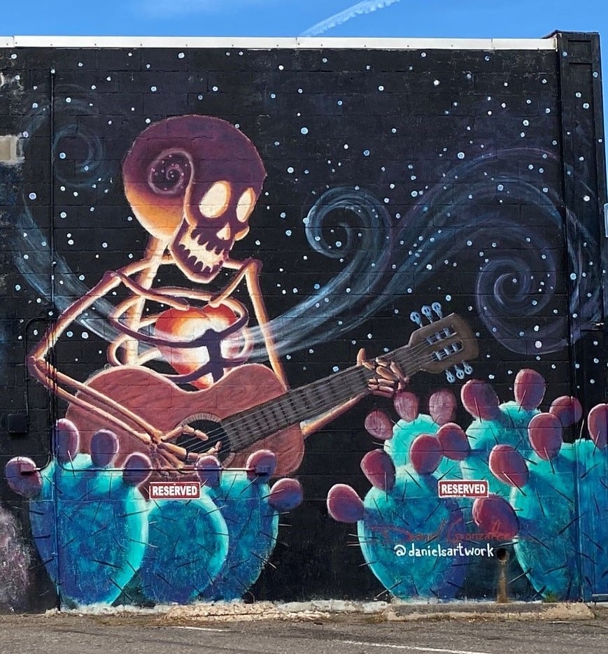 Untitled - skeleton playing guitar near cactus by Daniel Gonzalez  Image: "Untitled - skeleton playing guitar near cactus" by Daniel Gonzalez, 2015 (close-up)