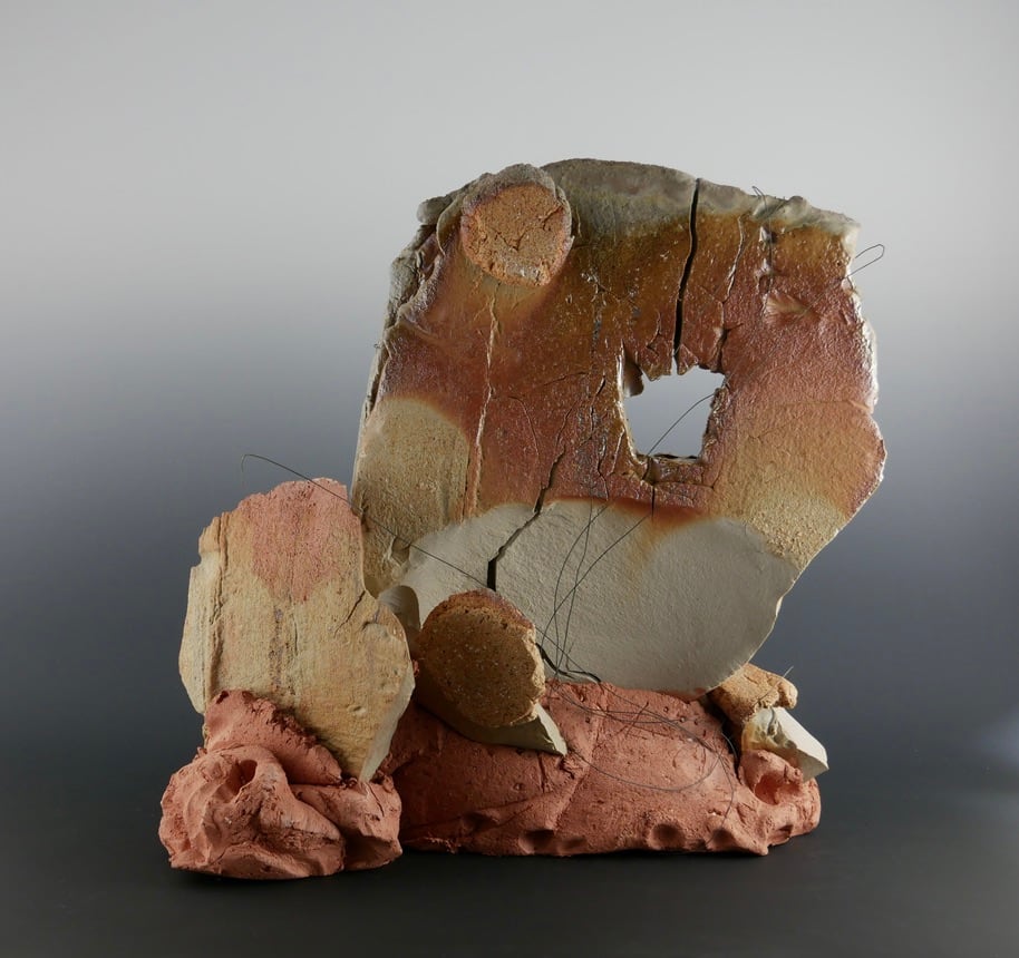 Harbinger by Danielle Callahan  Image: Wood fired stoneware sculpture.  Nichrome wire additions, two types of clay, fired twice. Solid formed piece created outside on concrete slab, wood fired with natural ash glaze, re-formed,  fresh clay body added and re-fired to retain. 