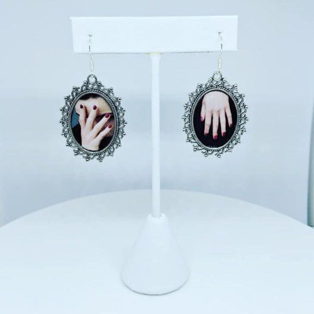 Face Palm (earrings) by Laura Collins 