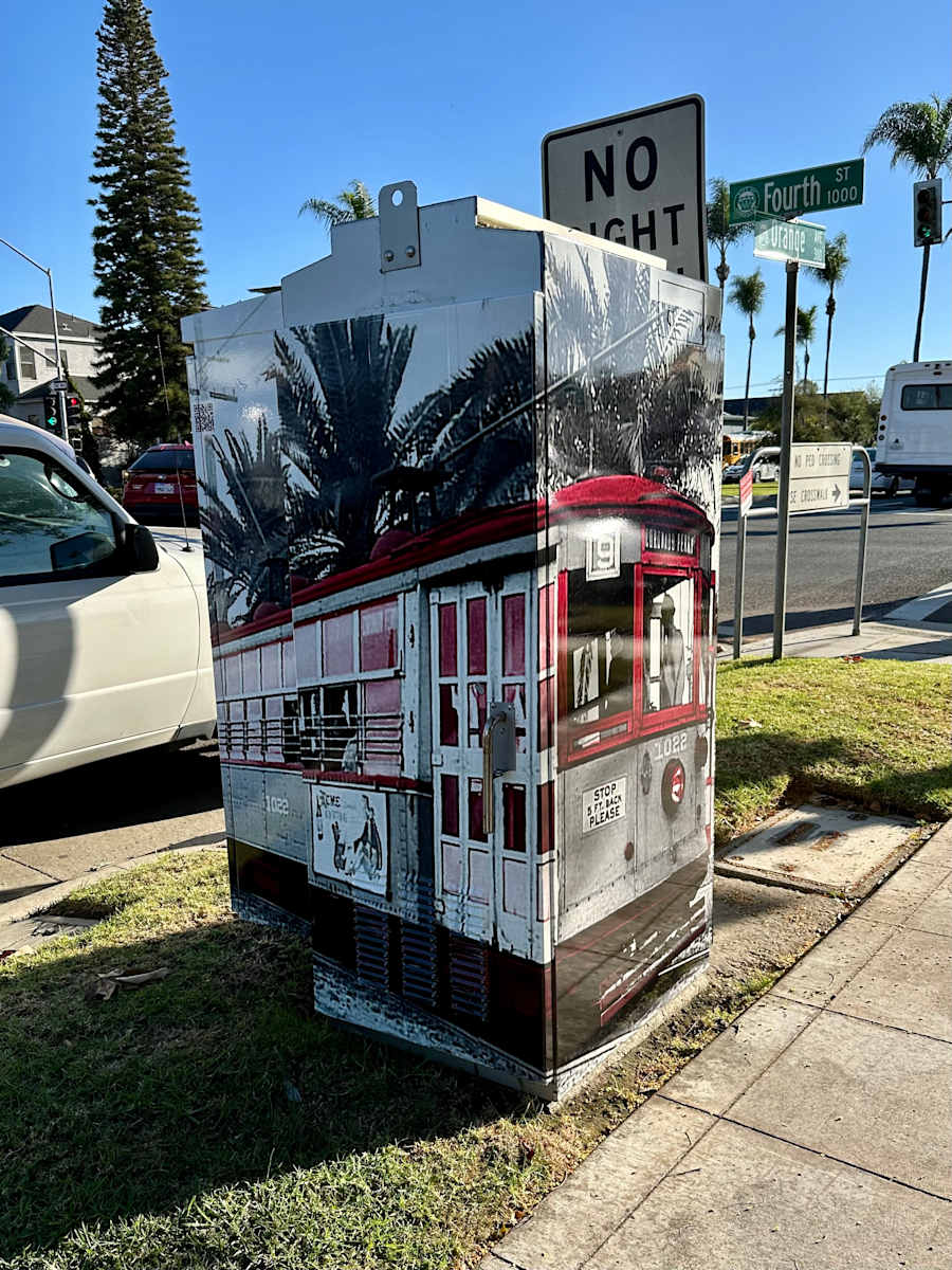 Art Outside the Box Take 2: 4th and Orange Avenue by Griffen Wong, Juniper Clark  Image: The trolley ran down the center of Orange Avenue from the ferry landing to Tent City, a significant part of island transport in the decades before the bridge was built. Date unknown. Coronado Historic Association Collection. Rights reserved.