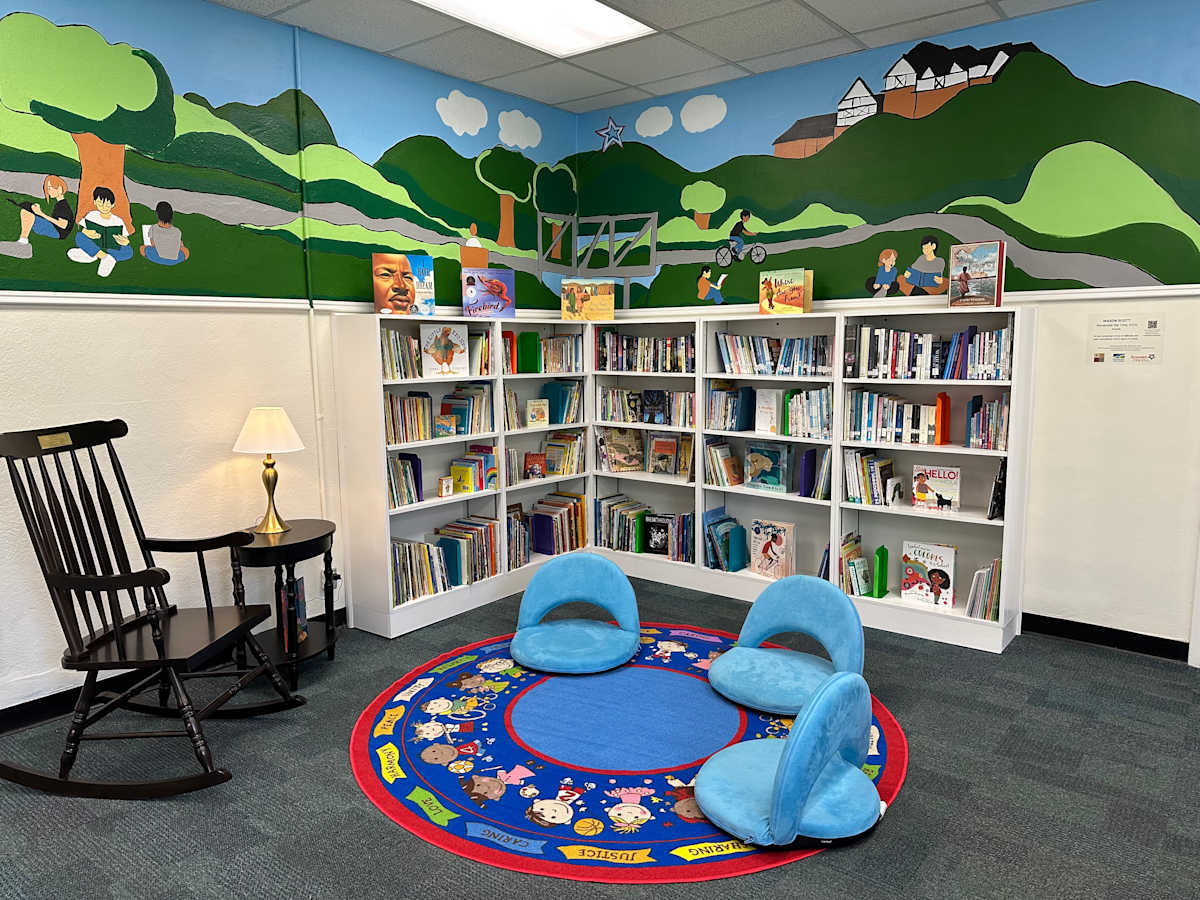 Remember the Tme by Mason Scott  Image: The library of the RCPS Community Empowerment Center includes the mural "Remember the Time," by Mason Scott.