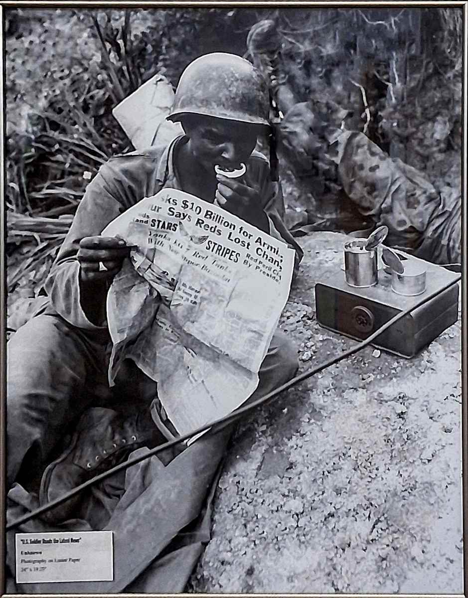 US Soldier Reads the Latest News by Unknown 