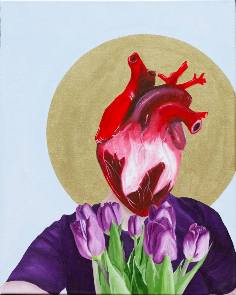 Self Portrait 2 by Olivia Franklin  Image: Self Portrait 2 is an original oil painting where I reimagine my face as my heart, merging identity and emotion into one. I hold purple tulips in front of the heart-face—symbols of admiration, grace, and deep emotion. The light blue background creates a sense of calm, while a gold halo radiates behind, representing resilience and transformation.
This figurative contemporary artwork blends surrealism and symbolism, inviting viewers to reflect on vulnerability, strength, and self-discovery.