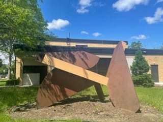 Voices, Thoughts, and Spirits in the Wind by Richard Field  Image: Photo of sculpture taken from the south in June, 2022, after cleaning and repainting.