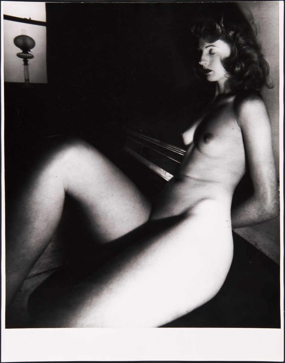 Black and white photograph of a sitting nude female by Bill Brandt 