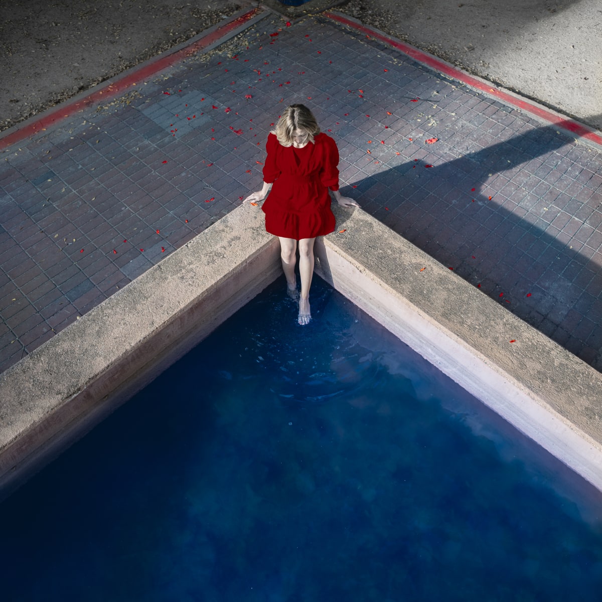 Deep into the Waters by Dasha Pears  Image: One crimson drop in the endless blue ocean. Making its way against the stream.