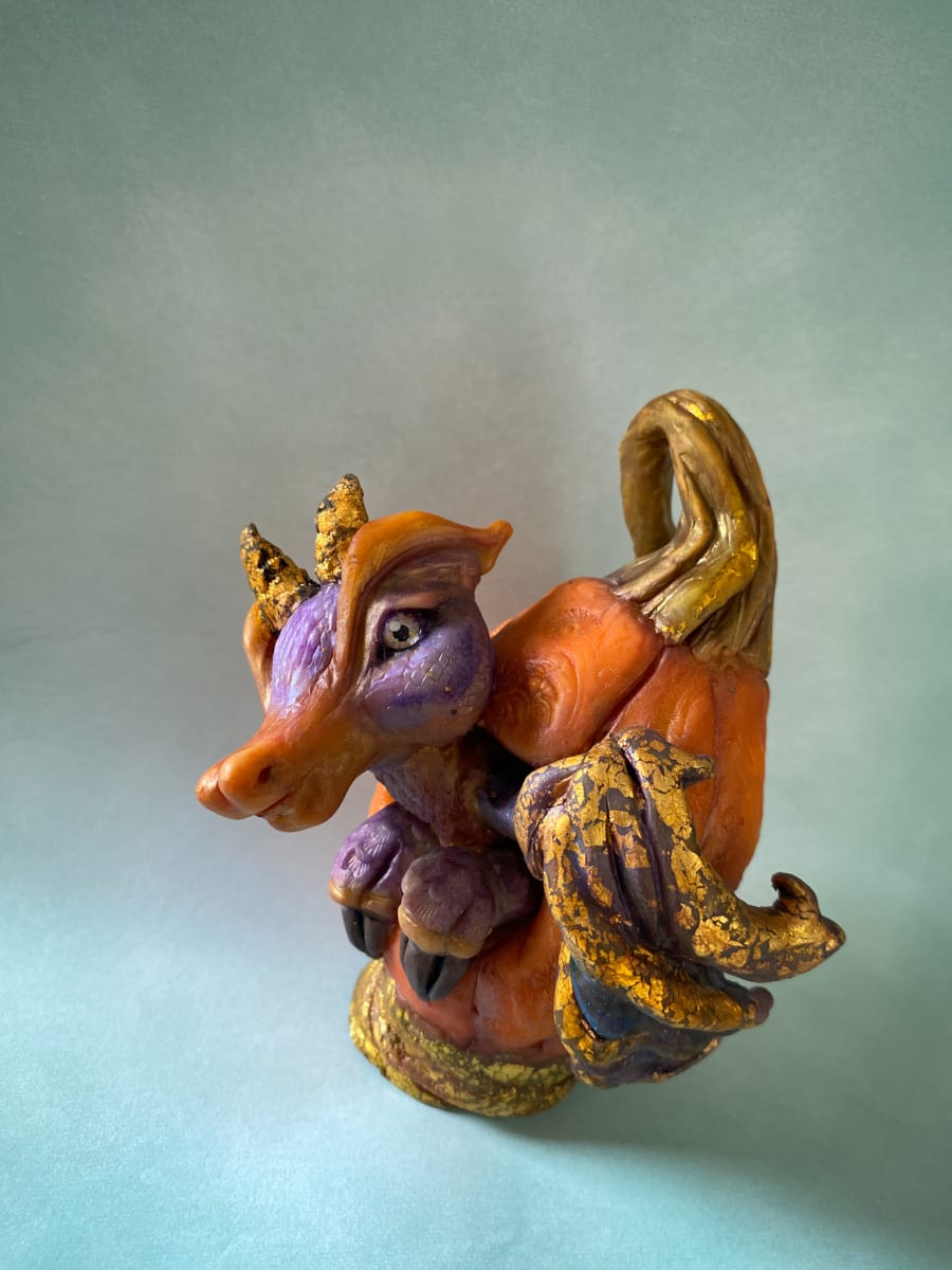 "Jasper"  Purple Dragon Sculpture  Image: This original sculpture features "Jasper"  the purple dragon emerging from his pumpkin to enjoy some trick-or-treating time.
