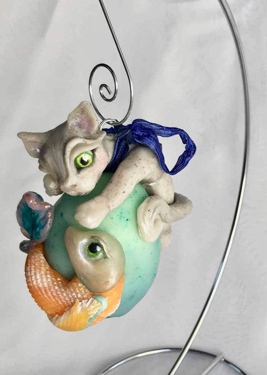 "Fishing for Sushi "Hand-sculpted Ornament  Image: A 3-dimensional piece from polymer clay over a hollow chicken eggshell. I use a lot of translucent clay in my custom color mixes which gives the clay a beautiful waxy finish.