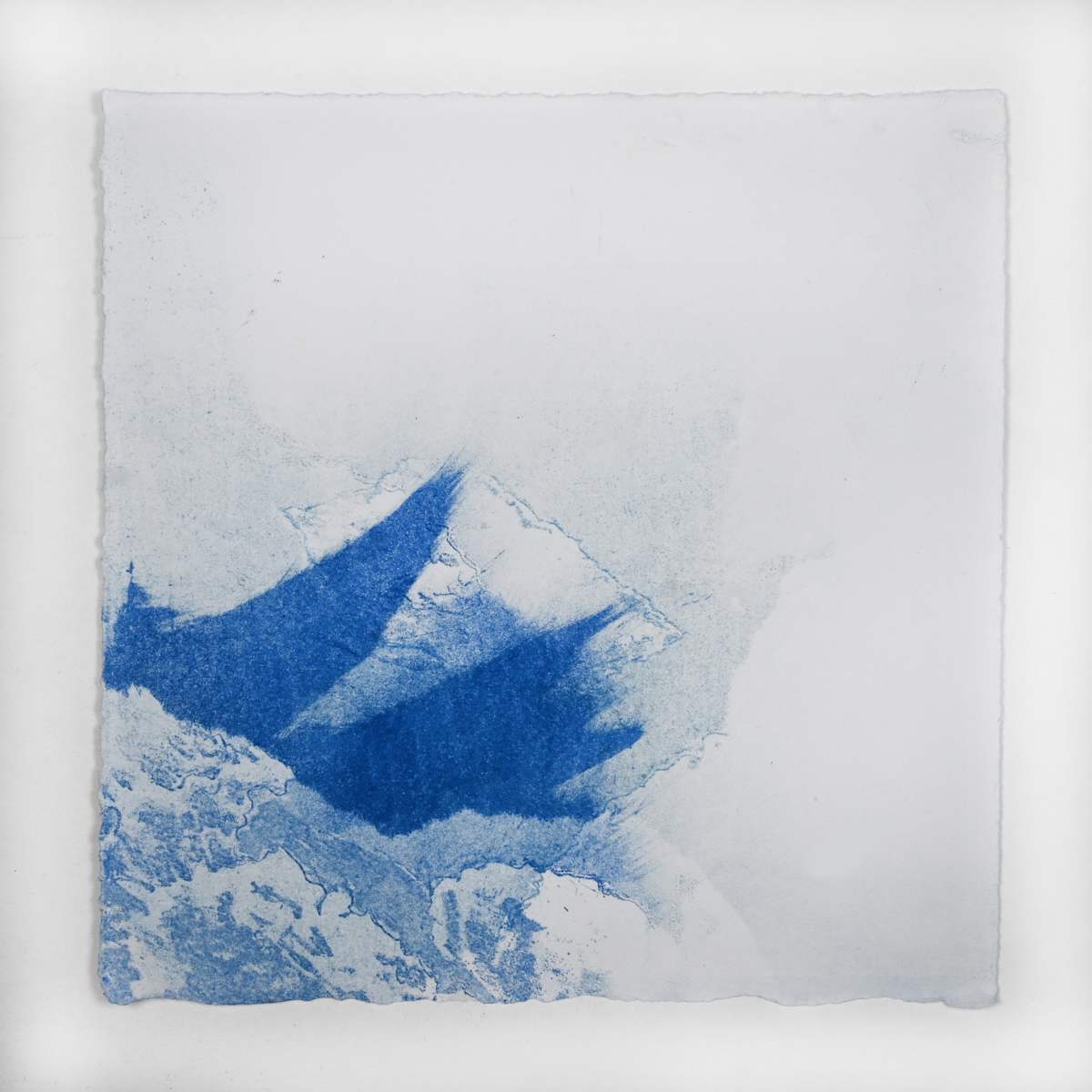 Ice Watch Studies #56 by Megan Broughton  Image: A series of experimental etchings evoking atmospheric Arctic seascapes. These pieces were made in memory of ice watches during the MaréMotrice artist residency in Greenland, sailing through foggy fjords. They function like a brilliant, shapeshifting, reveal through the fog and play with Arctic mirages and cause tricks of the eye. There are moments of clear detail and sublime wonder amidst fragmentation. Two etching plates were printed over each other multiple times in different orientations to create new and abstracted imagery. Stencils made of torn newsprint were used to block ink during the printing process, creating the white shapes throughout the works. The stencils were continually torn apart and reused throughout the series so that the stencil shapes become self-referential but are constantly transforming and deteriorating.