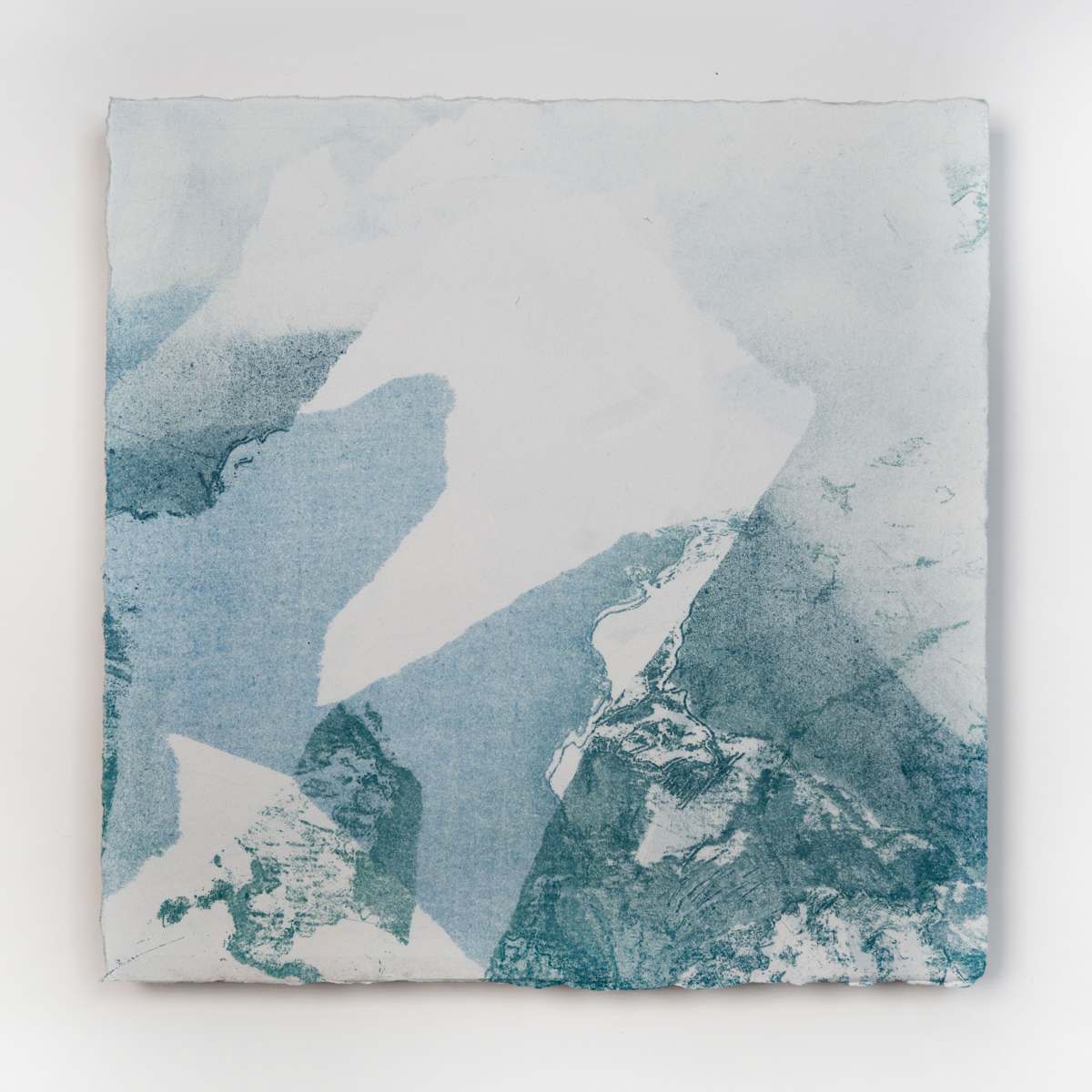 Ice Watch Studies #10 by Megan Broughton  Image: A series of experimental etchings evoking atmospheric Arctic seascapes. These pieces were made in memory of ice watches during the MaréMotrice artist residency in Greenland, sailing through foggy fjords. They function like a brilliant, shapeshifting, reveal through the fog and play with Arctic mirages and cause tricks of the eye. There are moments of clear detail and sublime wonder amidst fragmentation. Two etching plates were printed over each other multiple times in different orientations to create new and abstracted imagery. Stencils made of torn newsprint were used to block ink during the printing process, creating the white shapes throughout the works. The stencils were continually torn apart and reused throughout the series so that the stencil shapes become self-referential but are constantly transforming and deteriorating. Mounted on a cradled wooden panel.