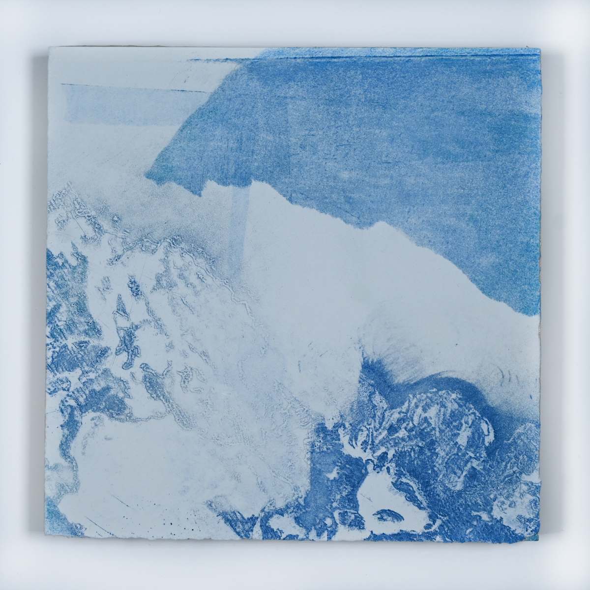 Ice Watch Studies #63 by Megan Broughton  Image: A series of experimental etchings evoking atmospheric Arctic seascapes. These pieces were made in memory of ice watches during the MaréMotrice artist residency in Greenland, sailing through foggy fjords. They function like a brilliant, shapeshifting, reveal through the fog and play with Arctic mirages and cause tricks of the eye. There are moments of clear detail and sublime wonder amidst fragmentation. Two etching plates were printed over each other multiple times in different orientations to create new and abstracted imagery. Stencils made of torn newsprint were used to block ink during the printing process, creating the white shapes throughout the works. The stencils were continually torn apart and reused throughout the series so that the stencil shapes become self-referential but are constantly transforming and deteriorating.
