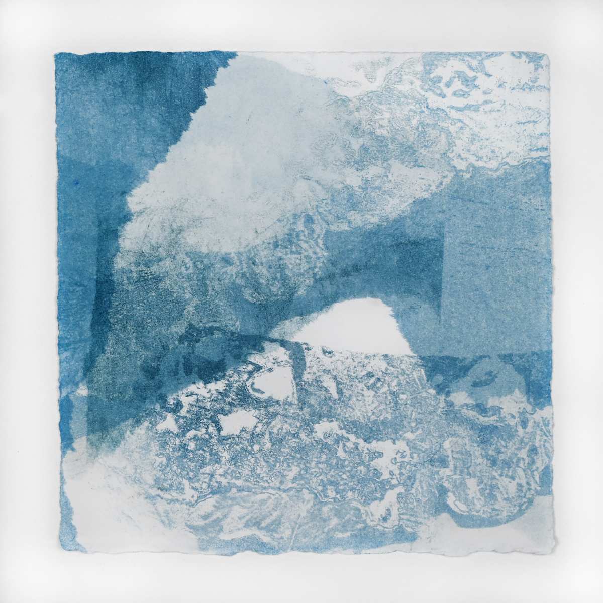 Ice Watch Studies #53 by Megan Broughton  Image: A series of experimental etchings evoking atmospheric Arctic seascapes. These pieces were made in memory of ice watches during the MaréMotrice artist residency in Greenland, sailing through foggy fjords. They function like a brilliant, shapeshifting, reveal through the fog and play with Arctic mirages and cause tricks of the eye. There are moments of clear detail and sublime wonder amidst fragmentation. Two etching plates were printed over each other multiple times in different orientations to create new and abstracted imagery. Stencils made of torn newsprint were used to block ink during the printing process, creating the white shapes throughout the works. The stencils were continually torn apart and reused throughout the series so that the stencil shapes become self-referential but are constantly transforming and deteriorating. 