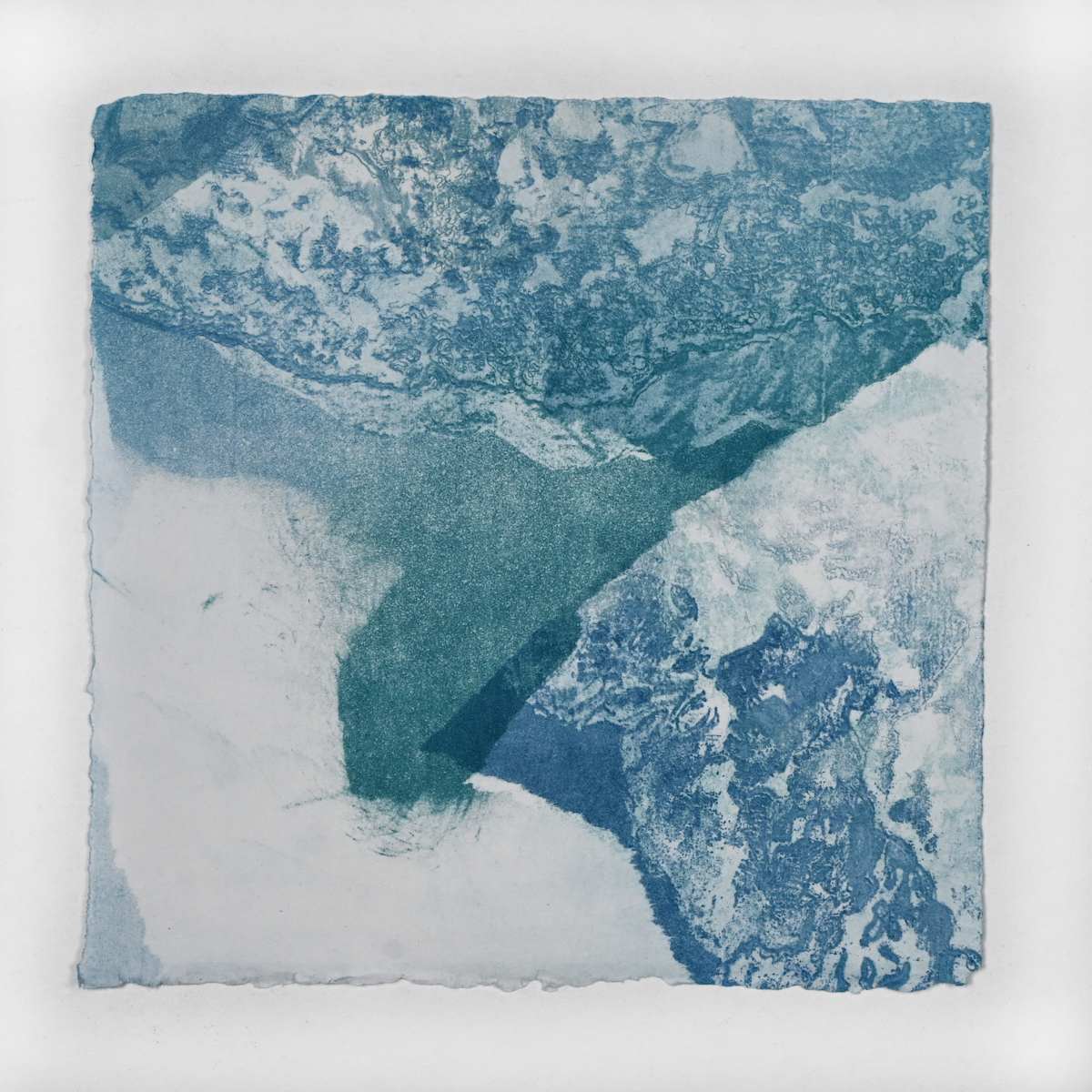 Ice Watch Studies #54 by Megan Broughton  Image: A series of experimental etchings evoking atmospheric Arctic seascapes. These pieces were made in memory of ice watches during the MaréMotrice artist residency in Greenland, sailing through foggy fjords. They function like a brilliant, shapeshifting, reveal through the fog and play with Arctic mirages and cause tricks of the eye. There are moments of clear detail and sublime wonder amidst fragmentation. Two etching plates were printed over each other multiple times in different orientations to create new and abstracted imagery. Stencils made of torn newsprint were used to block ink during the printing process, creating the white shapes throughout the works. The stencils were continually torn apart and reused throughout the series so that the stencil shapes become self-referential but are constantly transforming and deteriorating. 
