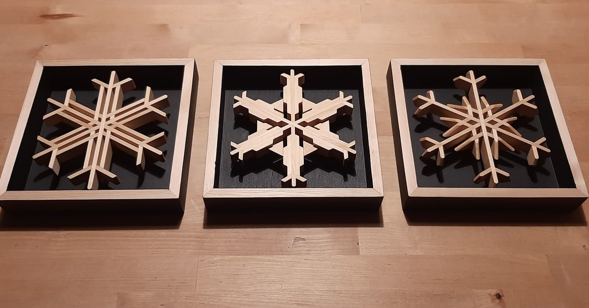 Individual 8"x8" Square Framed Snowflakes by Robert E LeBlanc  Image: Birch shadow frames, either flat black to highlight white snowflakes, or various options to highlight multi-coloured flakes.