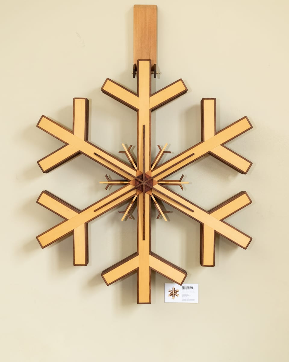 Gemini by Robert E LeBlanc  Image: Double sided snowflake that can be suspended and rotated to show the  intricate joinery.